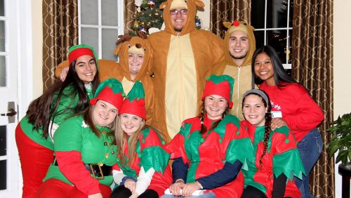 Rivier students in Christmas costumes