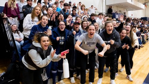 Rivier students cheering